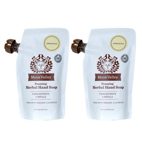 Moon Valley Organics front packaging showing two unscented refill pouches and eco benefit