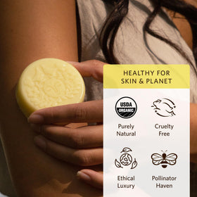 Moon Valley Organics bar with calendula and comfrey herbs depicting natural ingredients