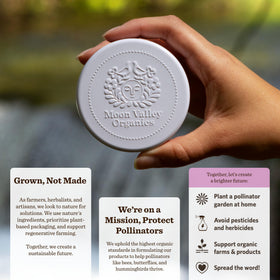 Moon Valley Organics massaging melted bar into a knee for soothing comfort
