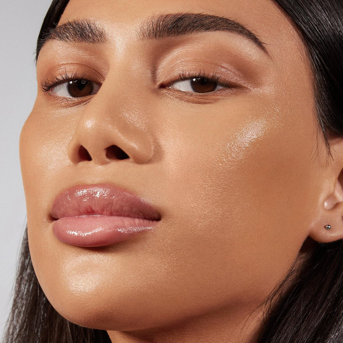 Morphe Lightform texture swatch on hand highlighting smooth spreadability and hydrated finish