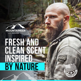 Mountaineer Brand bundle in use with man applying product to scalp for smoother shave prep