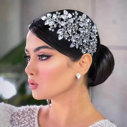 Mpoikba front view shows headpiece sparkle and polished finish for bridal styling