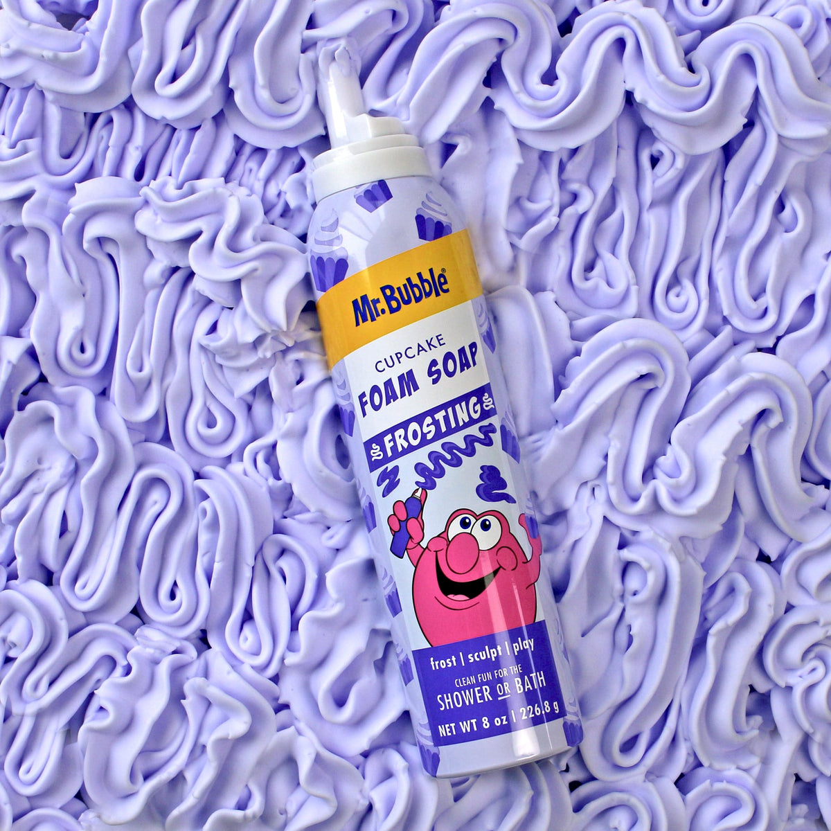 Mr. Bubble size comparison in hand showing 8 oz travel‑friendly benefit