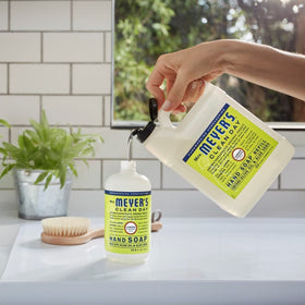 Mrs. MEYER'S refills staged at a bathroom sink showing soothing scent benefit