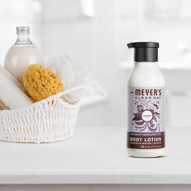 Mrs. MEYER'S bottle next to hand showing 16 fl oz scale and travel-friendly size