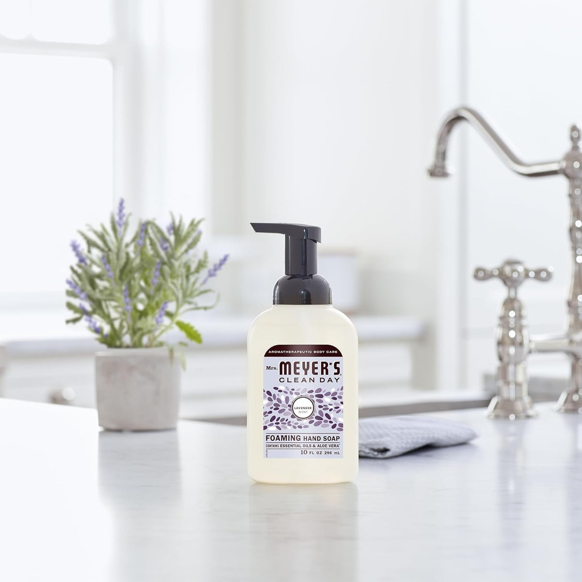 Mrs. Meyer's bottles styled in a bathroom showcasing coordinated home scent