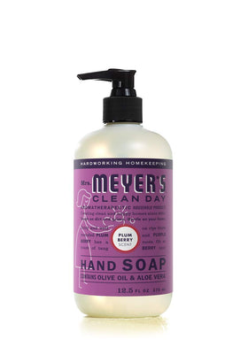 Mrs. Meyer's Plumberry bottle label visible emphasizing fruity scent and household freshness benefit