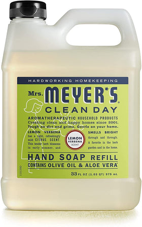 Mrs. MEYER'S pouring refill into dispenser to show easy transfer and reduced plastic waste