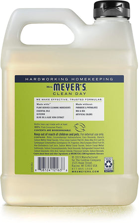 Mrs. MEYER'S pouring refill into dispenser to show easy transfer and reduced plastic waste