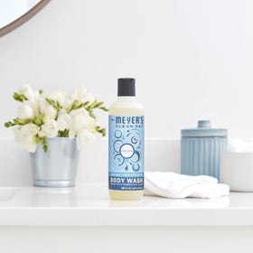 Mrs. Meyer's Rain Water bottle on bathroom shelf showcasing cohesive home fragrance