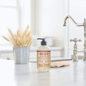 Mrs. MEYER'S refill pouch beside dispenser showing refill size and compatibility