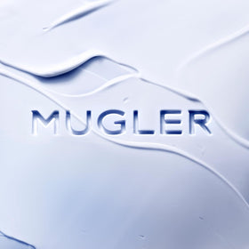 Mugler Angel lotion texture pouring from tube showing creamy hydration benefit