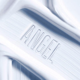 Mugler angel frosted jar detail highlighting sparkling shooting star for an artful vanity accent