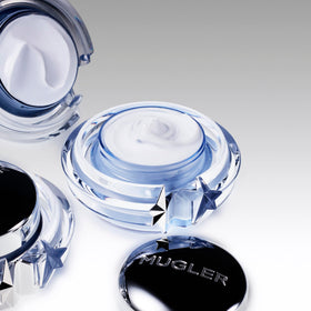 Mugler angel cream texture closeup demonstrating rich creaminess for quick skin absorption benefit