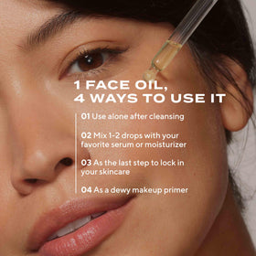 Murad oil mixed with serum on palm to show blending and layering benefit for added glow