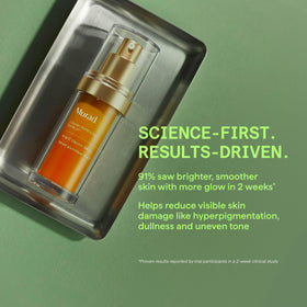 Murad serum texture drop on fingertip showing lightweight absorption
