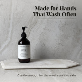 Murchison-Hume hand in use rinsing soap to show effective, non-drying clean