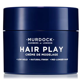 Murdock London paste being applied to hair for natural textured finish