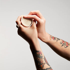 Murdock London paste being warmed in hands for effortless application