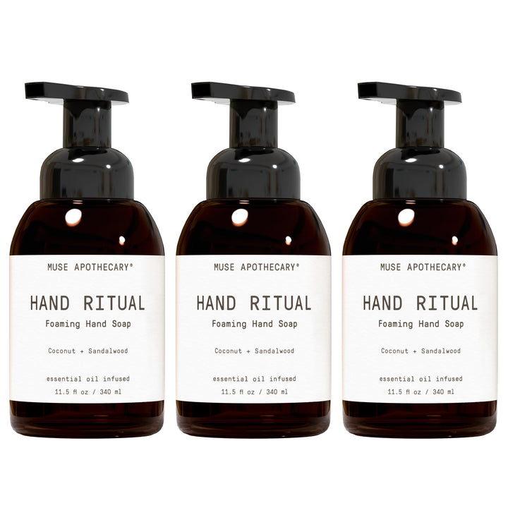 Muse Apothecary front bottle showing Coconut + Sandalwood branding and elegant label benefit