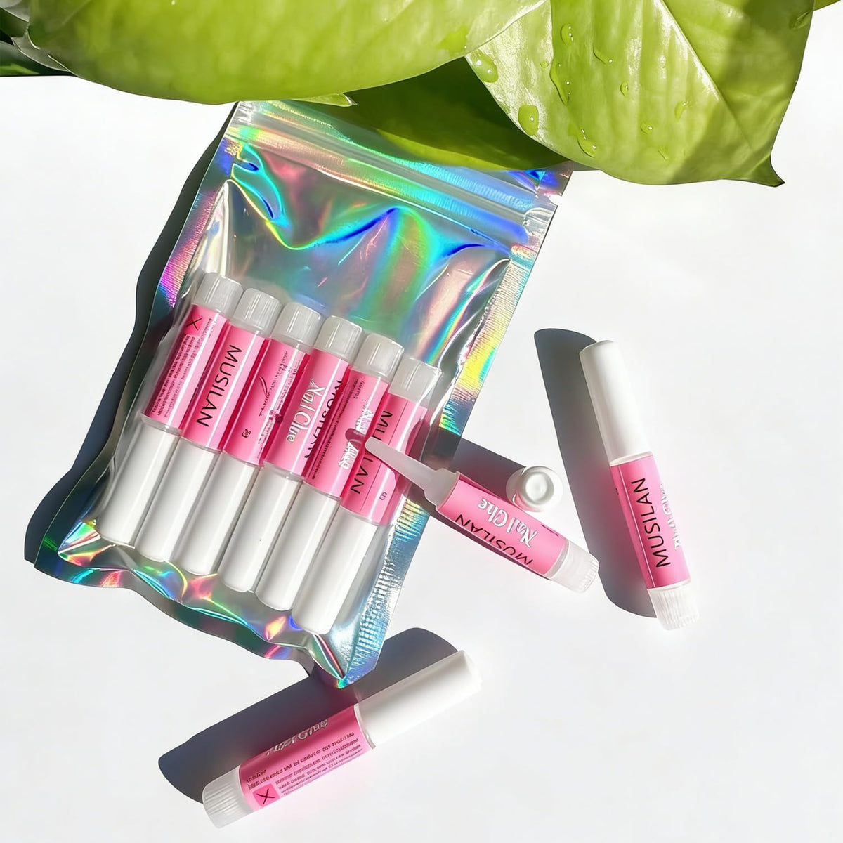 MUSILAN size comparison with fingers showing compact portable tubes