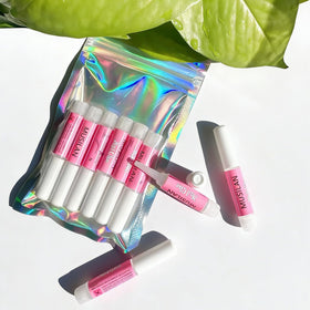 MUSILAN size comparison with fingers showing compact portable tubes