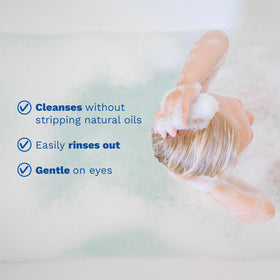 Smooth shiny baby hair after Mustela shampoo showing easier combing and softness