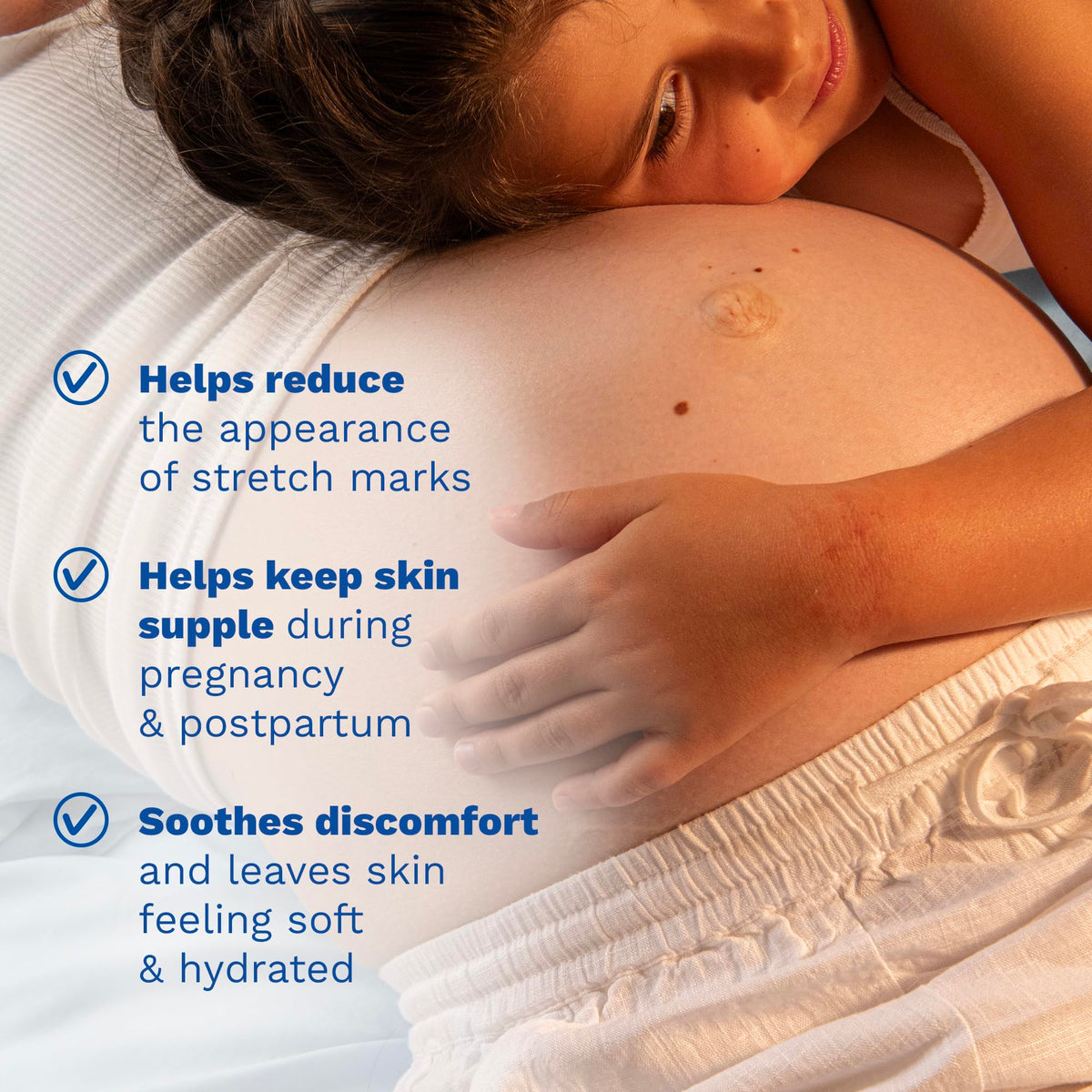Mustela bottle in hand showing travel-friendly size and easy pump