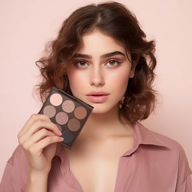 MYSTER ROSEY compact beside a smartphone to show travel-friendly size