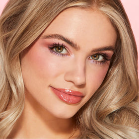MYSTER ROSEY applied by model at mirror demonstrating easy, everyday use
