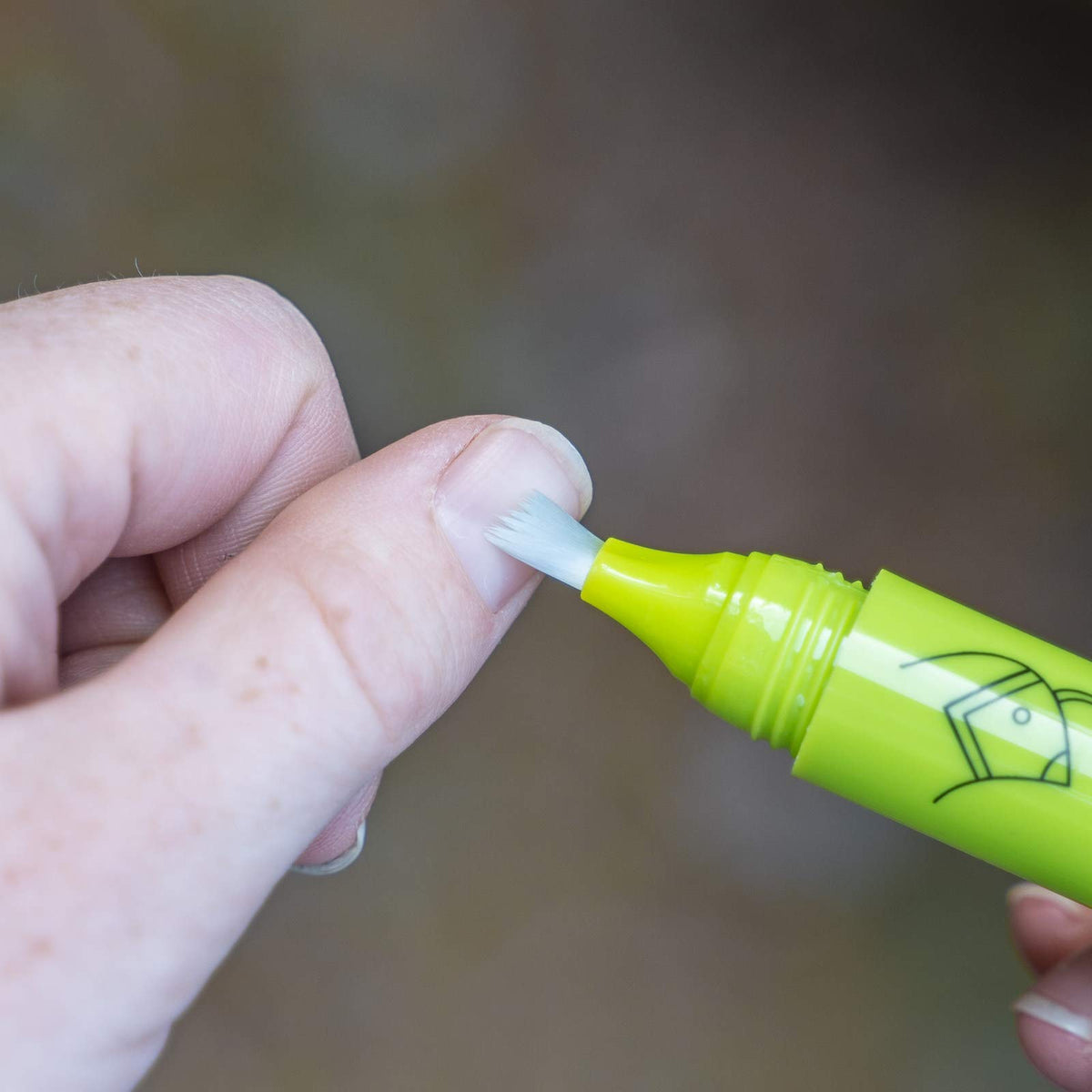 Nail Quail click pen with cap removed showing applicator and portability