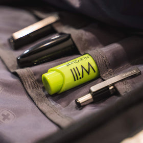 Nail Quail pen held in hand to show 7ml size and travel convenience