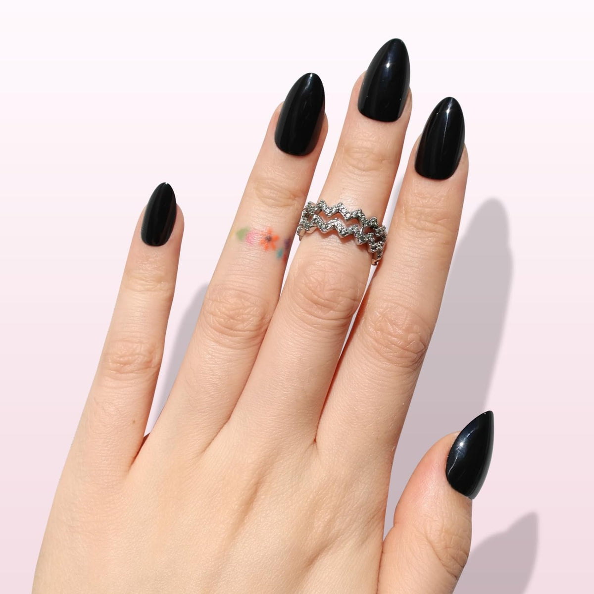 Nail Reformation short almond profile view demonstrating natural fit