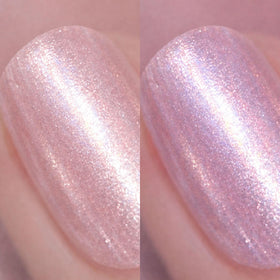 Nails Inc swatch of Paris pink-peach glitter shade showing vibrant sparkle