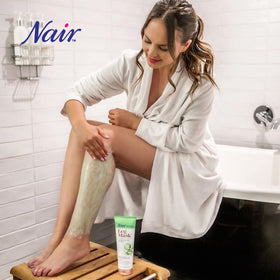 Nair tube next to a ruler for scale showing true 8-ounce size benefit