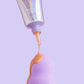 Naked Sundays bottle in hand to show true size and travel-friendly volume