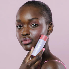 Naked Sundays dabbed on lips for tinted balm and sun protection