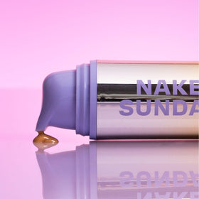 Product next to ruler showing 50ml size and Naked Sundays travel-friendly scale