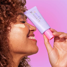 Naked Sundays tube inside makeup bag for travel convenience