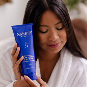 Nakery ingredients flatlay with shea, cocoa, mango butters emphasizing nourishing blend