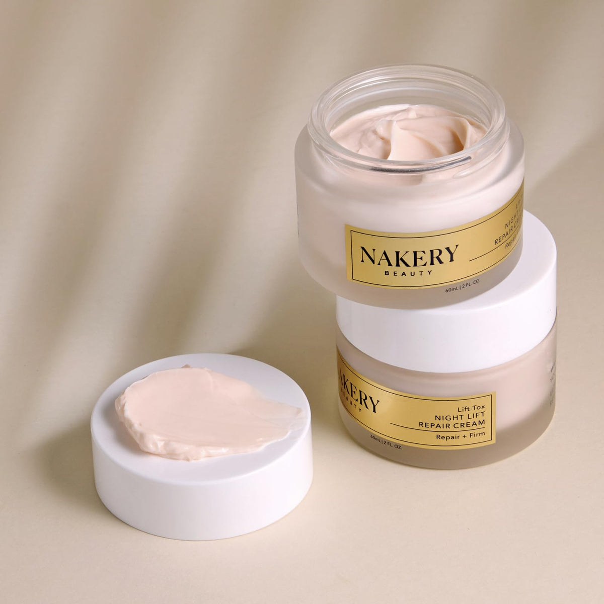 Nakery Lift-Tox next to a hand to show jar size and easy nightly dosage benefit