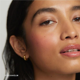 NAPH flush balm applied to cheek showing dewy finish and natural radiance
