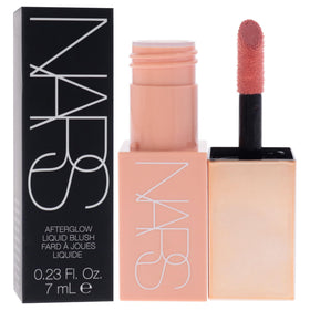 NARS Afterglow swatch on forearm revealing buildable soft pink flush