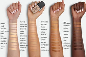 NARS bottle in hand to show 1 oz size and travel-friendly convenience