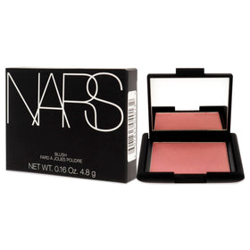NARS Orgasm compact inside makeup bag showing travel-ready size and versatile use