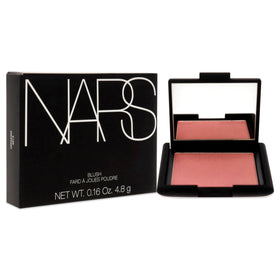 NARS Orgasm swatch on skin showing warm peach-pink glow and buildable color