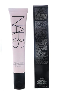 NARS primer next to a common coin showing 1.0 ounce scale for size clarity