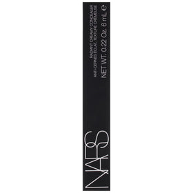 NARS concealer next to a coin showing size and travel-friendly 0.22 oz convenience