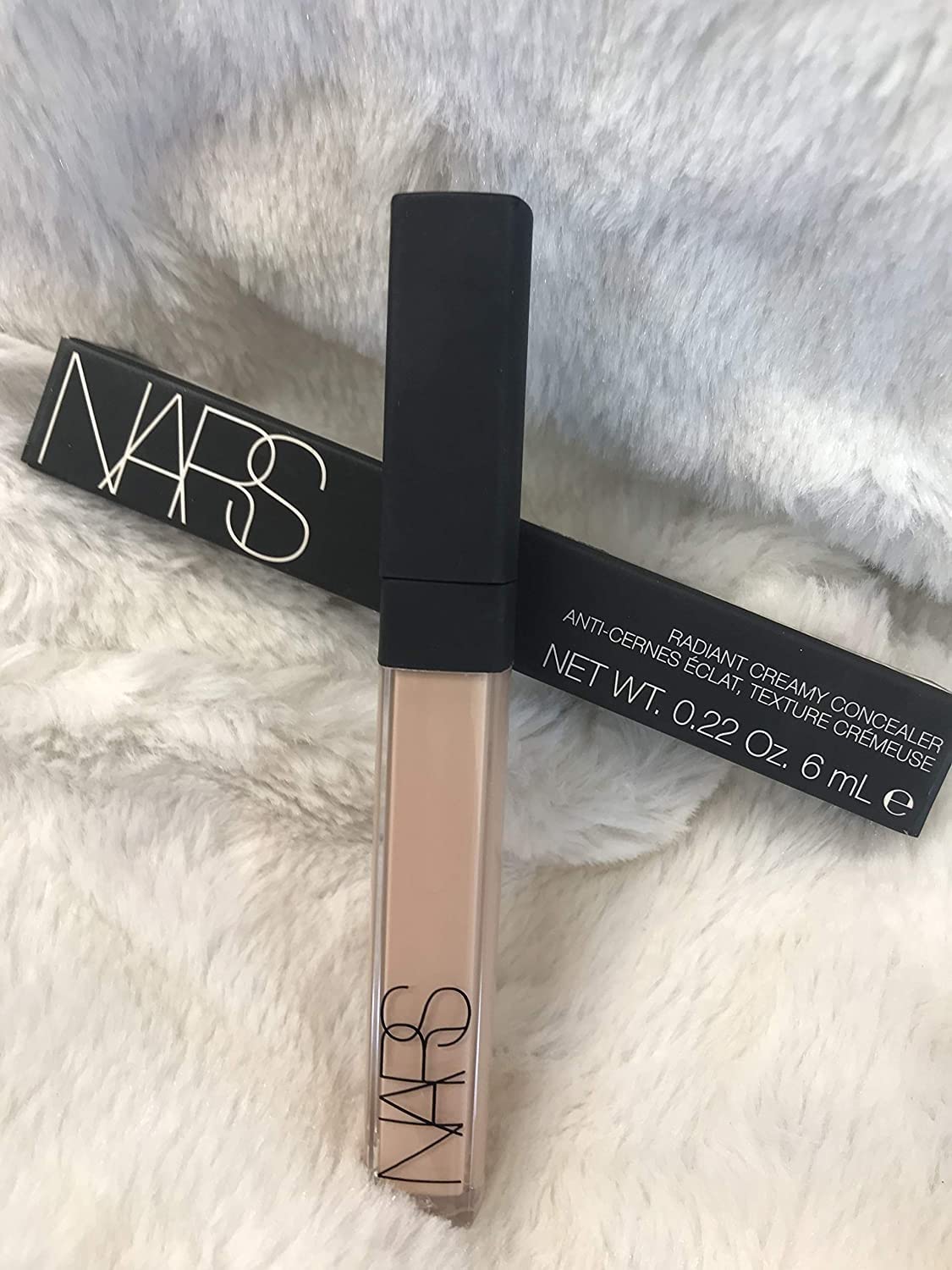 NARS concealer creamy texture swatch on arm demonstrating blendability and finish