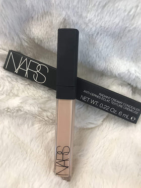 NARS concealer creamy texture swatch on arm demonstrating blendability and finish
